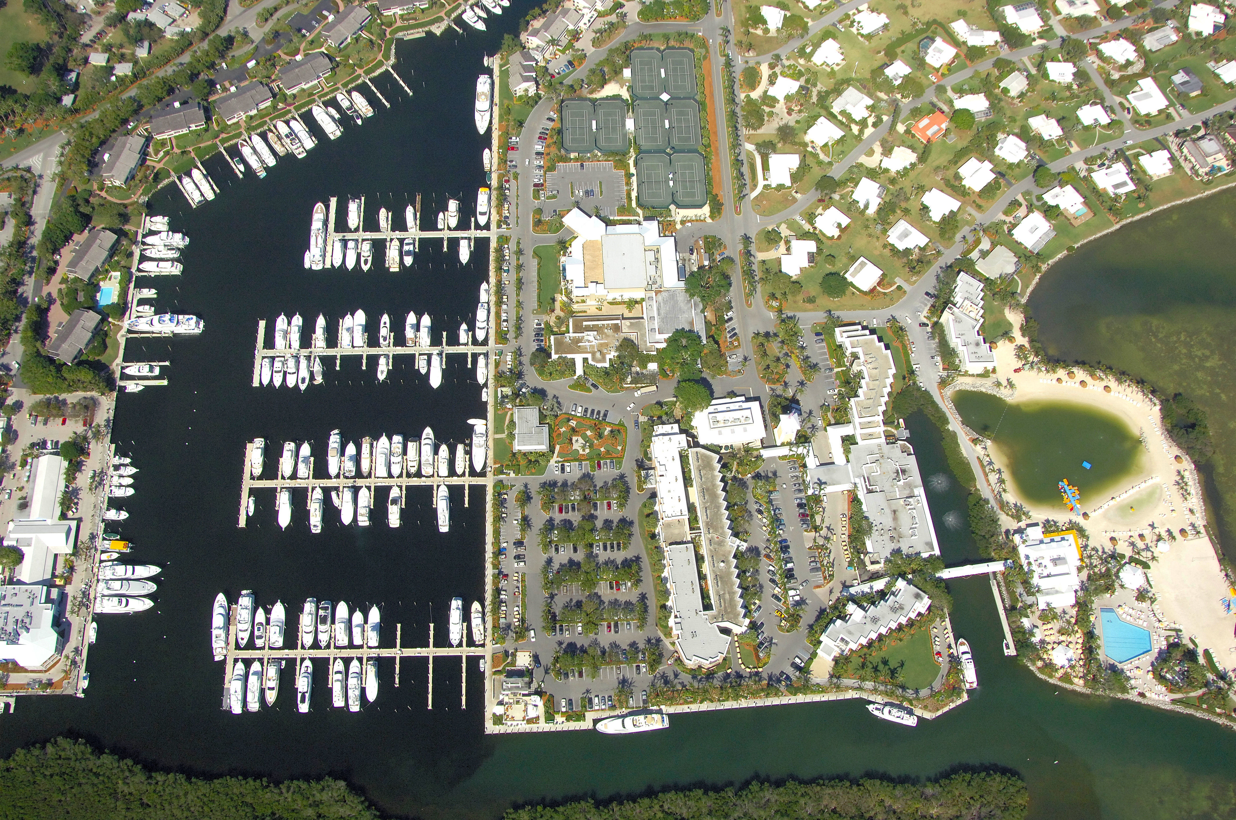Top-down aerial view of Ocean Reef Club marina and town center